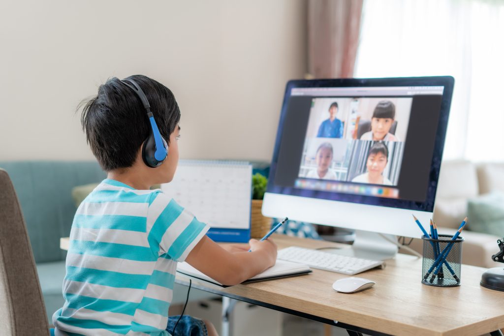 asian boy student video conference e learning with teacher classmates computer